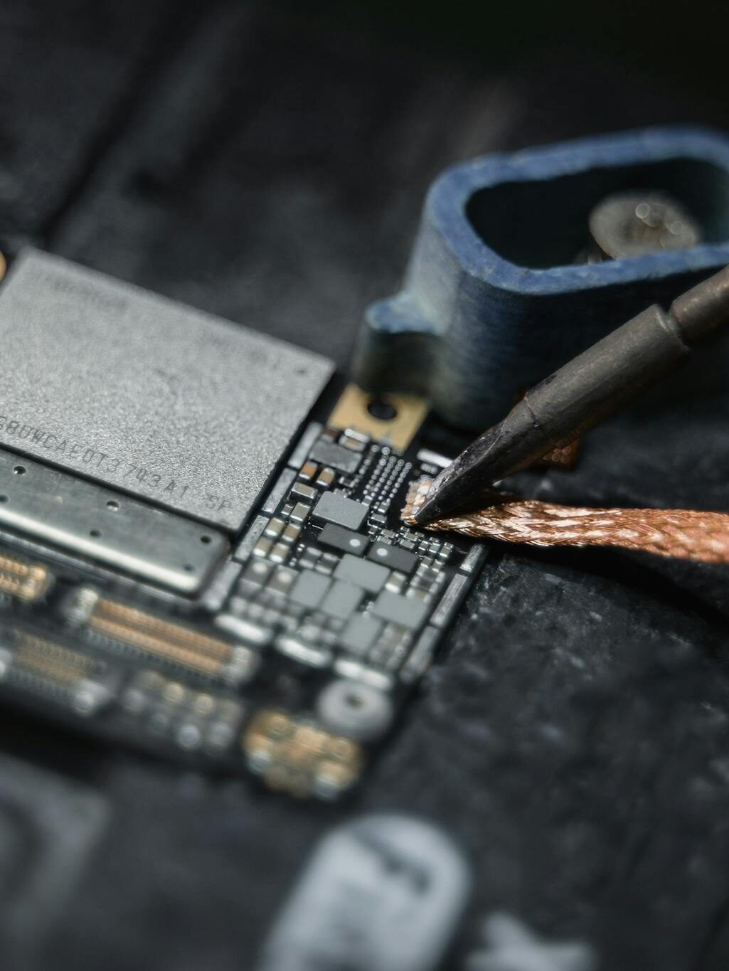 A Wire Being Soldered on the Motherboard